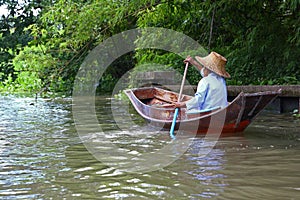 Woman paddling in Thailand