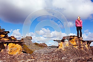 Woman on a pagoda rock Blue Mountains Australia