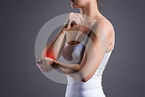 Woman with pain in elbow, joint inflammation