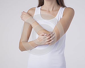 Woman with pain in elbow, joint inflammation isolated on white background