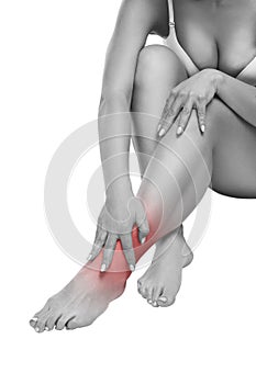 Woman with pain in the joint, massage of female feet, ache in the human body isolated on white background