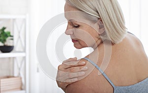 Woman with pain in shoulder. Pain in the human body,health care concept.