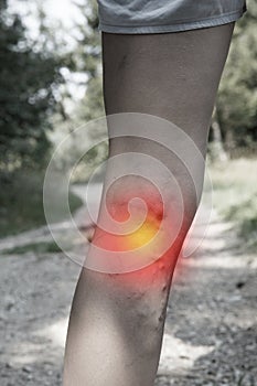 Woman with painful varicose veins and red dot effect