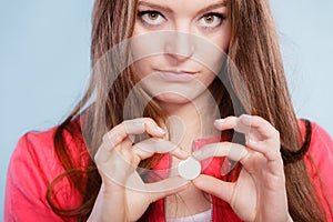 Woman with painkiller pill tablet. Health care.