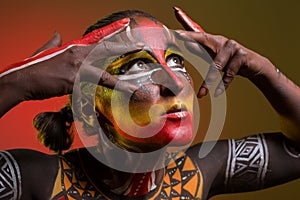 Woman painted with ethnic patterns