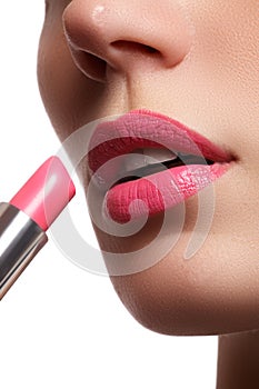 Woman painted pink lips. Beauty lips make-up. Perfect skin, full lips. Retro make up