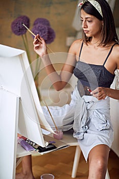 Woman with painting accessories creating arting