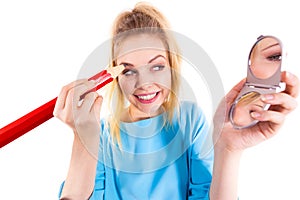 Woman painting eyebrows using regular pencil