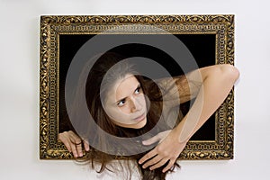 Woman in a painting frame