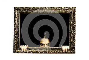 Woman in a painting frame