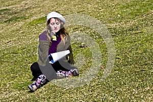 Woman painting on the grass