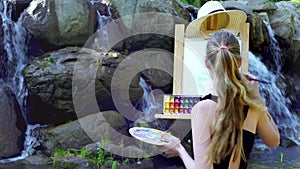 Woman painting open air. Visual art of plein artist outdoor