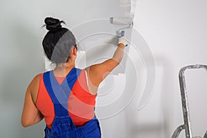 Woman painting a room