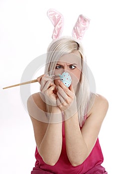 Woman paints easter egg