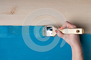 Woman paints the table