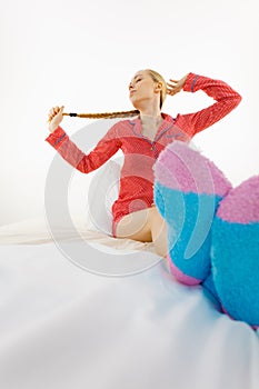 Woman in pajamas wearing furry warm socks