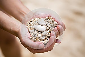 Woman palms holding pebble