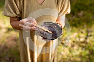 woman with palo santo performing magic ritual