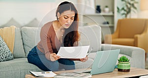 Woman, paper and laptop in living room on sofa working on project, assignment or task for college or business. Student