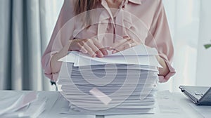 The woman with paperwork stack.AI generated image