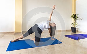 Woman in Parighasana yoga position