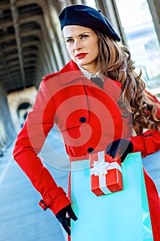 Woman In Paris with shopping bag and Christmas present box