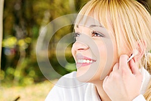 Woman in the park with earphones