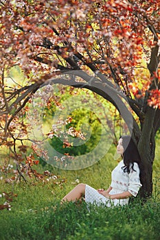 Woman in park. Pleasure of spring nature.