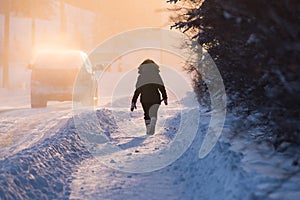 Woman In Parka Walking Down Cold Yellowknife Street