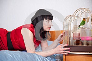 Woman with parrot in home