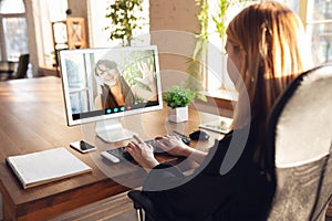 Woman participate video conference looking at laptop screen during virtual meeting, videocall webcam app for business