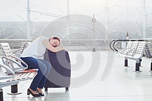 Woman passenger sleeping in the airport