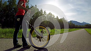 Woman passing through the road with unicycle 4k