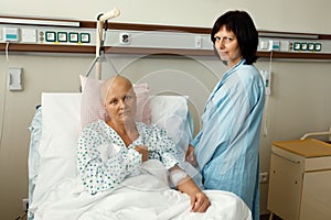 Woman patient with cancer in hospital with friend