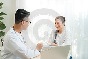 Woman patient consulting with doctor or psychiatrist on obstetric - gynaecological female illness, or mental health in medical