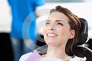 Woman patient at the dentist waiting to be checked up