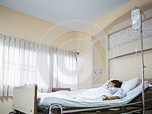 Woman patient in hospital bed