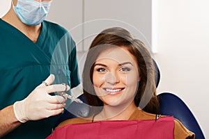 Woman patient and man dentist
