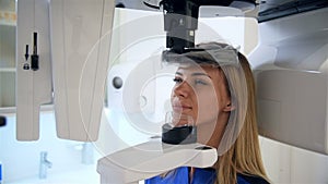 Woman Patient Standing In Dental Computed Tomograph.