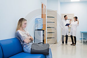 Woman patient waiting at hospital Doctors Waiting Room