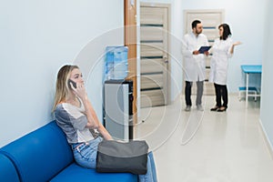 Woman patient waiting at hospital Doctors Waiting Room