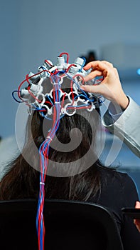 Woman patient wearing performant eeg headset scanning brain