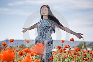 Woman in patterned sundress on flower field