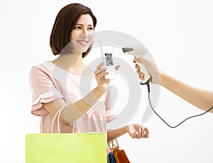 Woman pay by smart phone with qr code