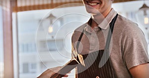 Woman paying bill through NFC technology