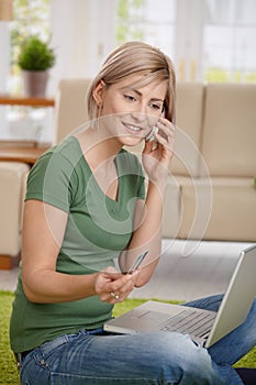Woman paying bills from home