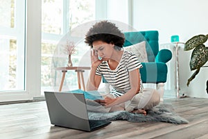 Woman paying bills online