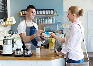 Woman paying for coffee