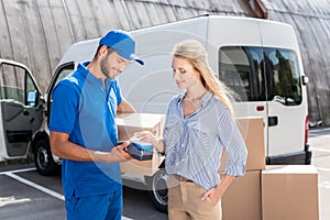 Woman paying for delivery with card