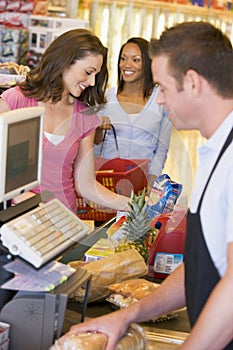 Woman paying for groceries